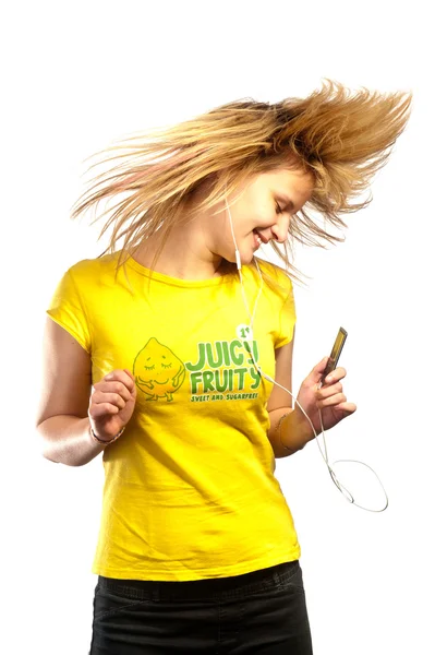 Young attractive girl dancing with a mp3 player — Stock Photo, Image