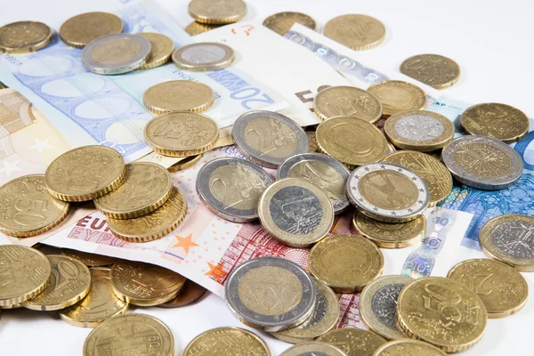 Euros Coins and Bank notes on a white background — Stock Photo, Image