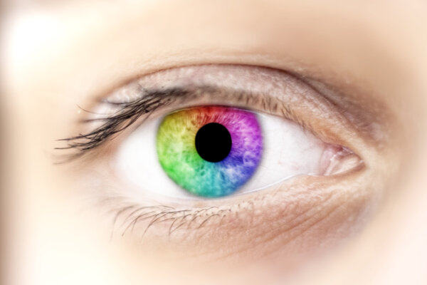 View of rainbow colours in a woman eye, make up concep