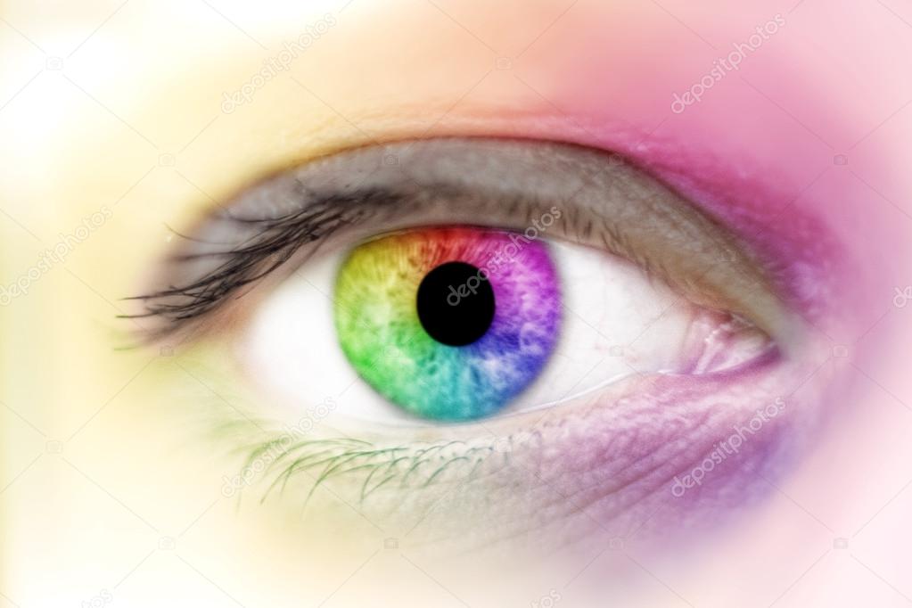 View of rainbow colours in a woman eye, make up concep