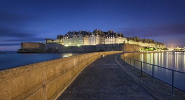 Great view at night of fortificated town Saint-Malo in Britanny clipart