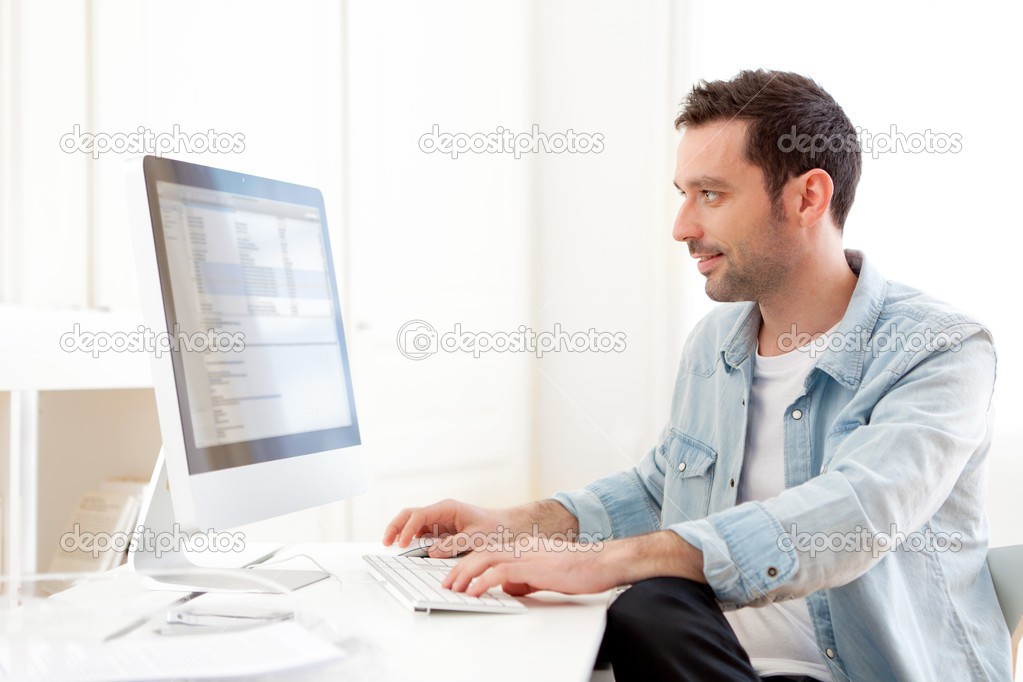 young relaxed man using computer
