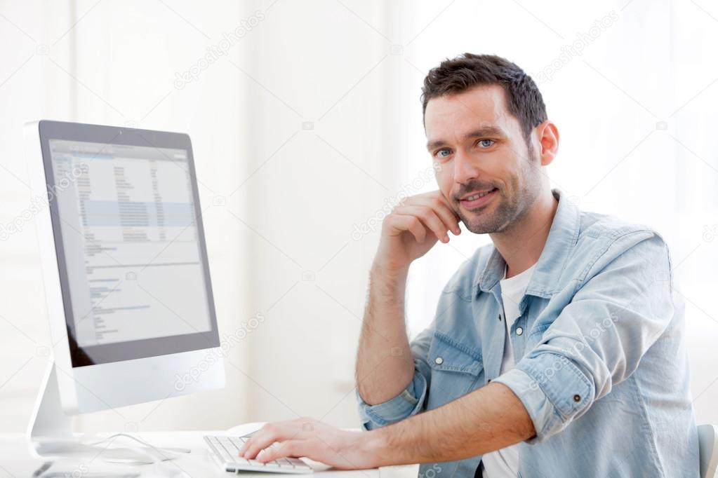 young relaxed man using computer
