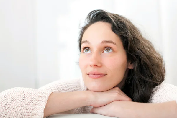 Portrait of an attractive thinking girl with curly hair — Stock Photo, Image