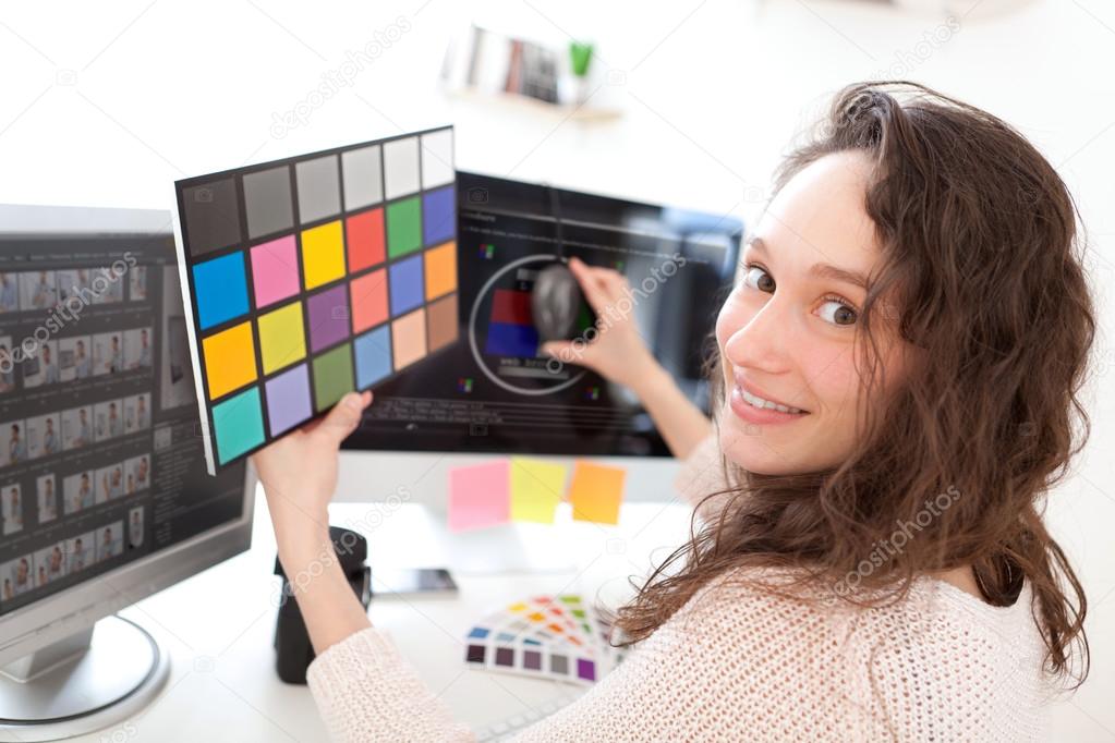 Woman photographer calibrate her screen