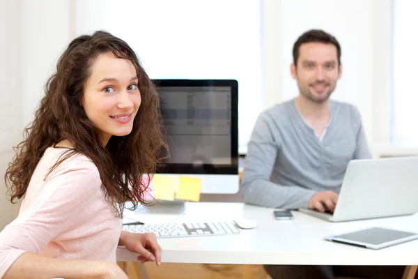 Young attractive co-worker at the office — Stock Photo, Image
