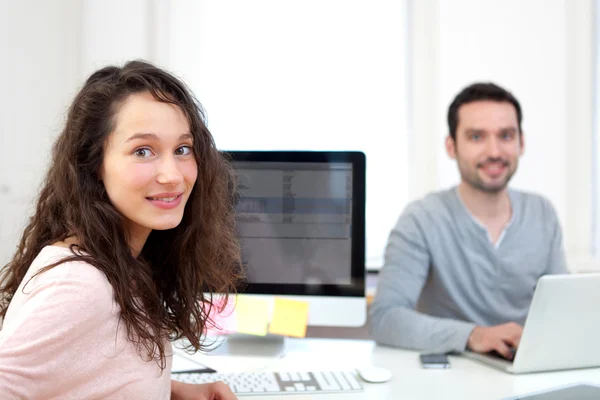 Young attractive co-worker at the office — Stock Photo, Image