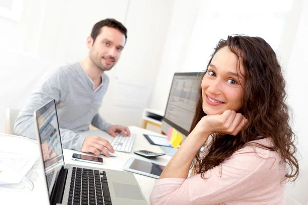 Young attractive co-workers at the office — Stock Photo, Image