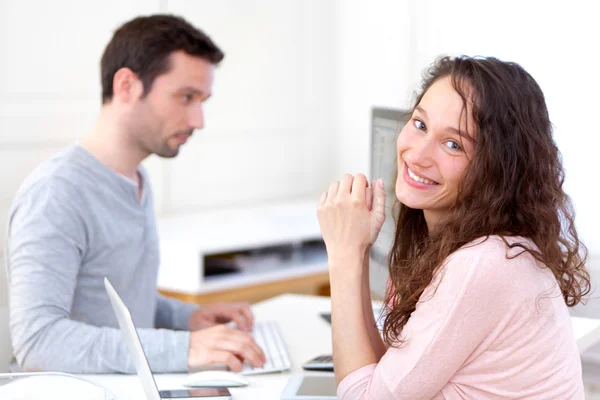 Young attractive co-workers at the office — Stock Photo, Image