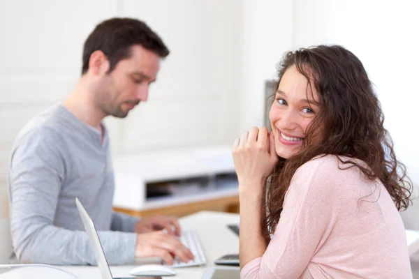 Young attractive co-workers at the office — Stock Photo, Image