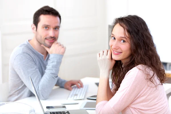 Young attractive co-workers at the office — Stock Photo, Image