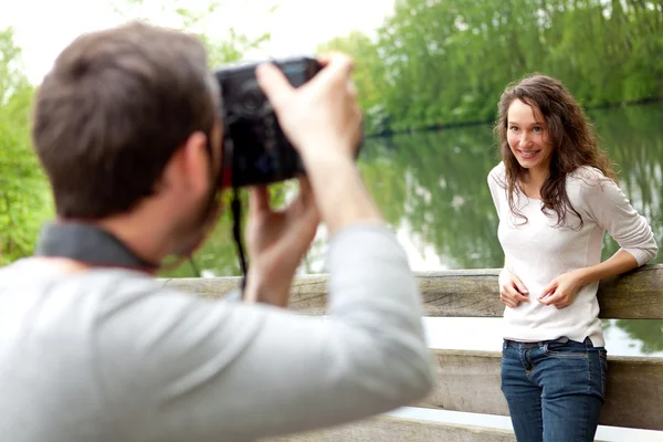 Photographer taking picture of an attractive model — Stock Photo, Image