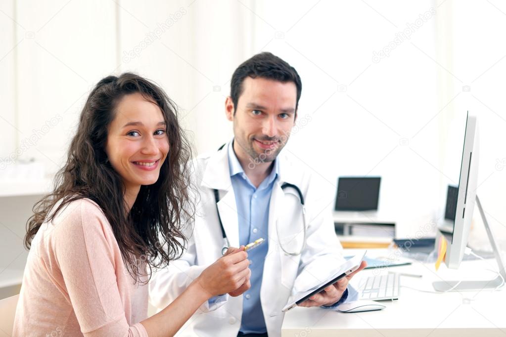 Doctor using tablet to inform patient 