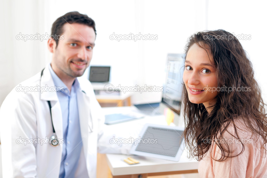 Doctor using tablet to inform patient 