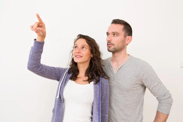 Couple using imaginary touchscreen interface — Stock Photo, Image