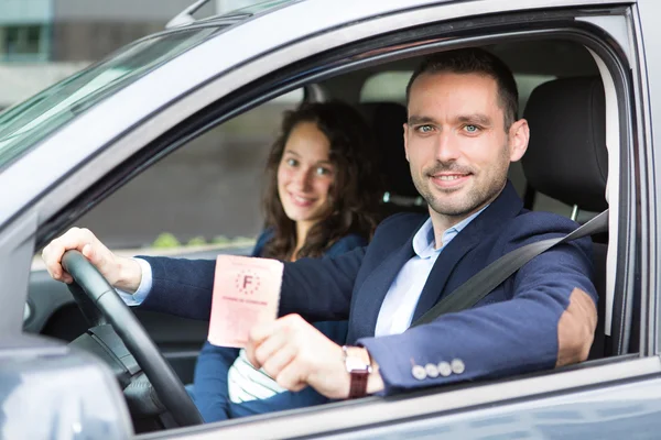 Driver in his car after getting his driving licence — Stock Photo, Image
