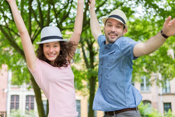 Young happy couple having fun at the park — Stock Photo, Image