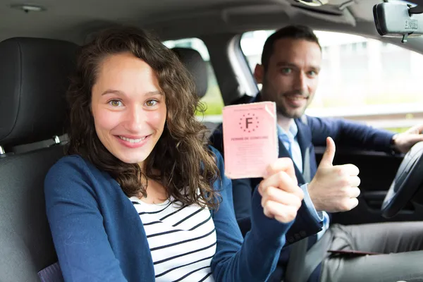 Driver in his car after getting his driving licence — Stock Photo, Image