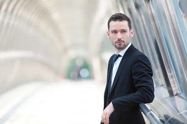 Portrait of an attractive businessman in a building — Stock Photo, Image