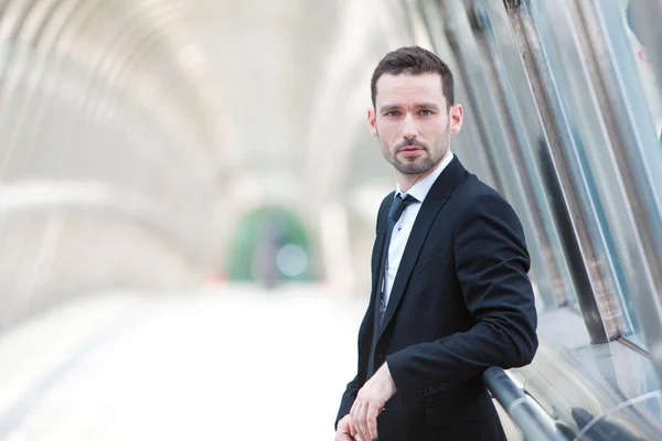 Portrait of an attractive businessman in a building — Stock Photo, Image