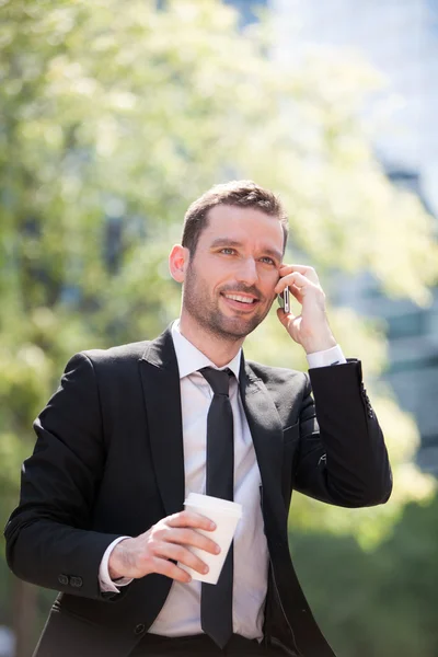 Businessman drinking a coffee during a break — Stock Photo, Image