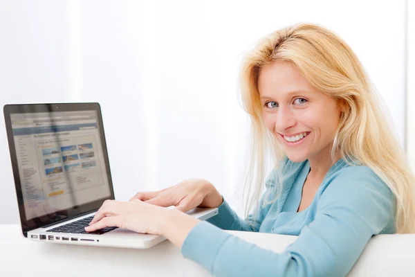 Young attractive woman surfing on internet Stock Image