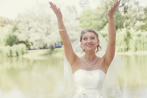 Bride with raised hands — Stock Photo, Image