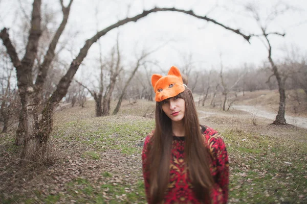 Woman in mask of a fox, in the park — Stock Photo, Image