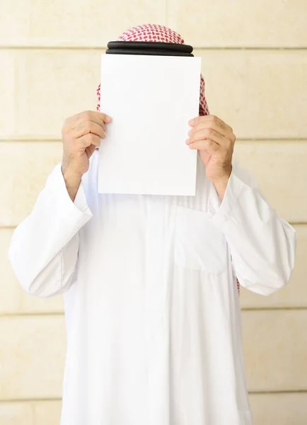 Man with long beard posing with empty copy space paper on his face — Stock Photo, Image