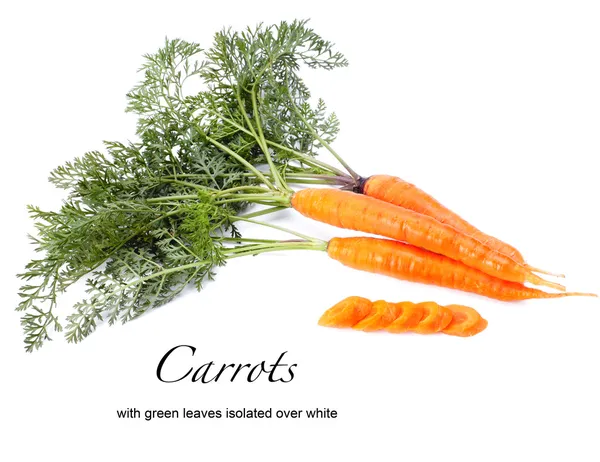 Orange carrots with green leaves isolated over white — Stock Photo, Image