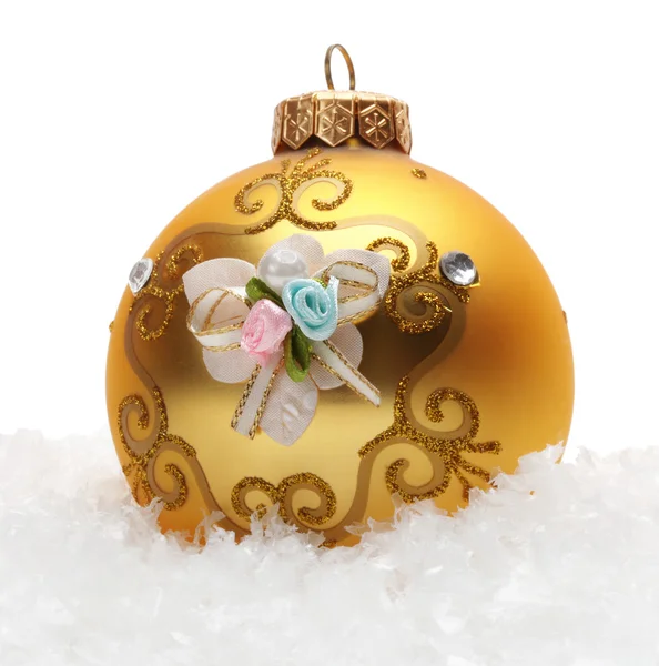 Gold Christmas balls in snow — 스톡 사진