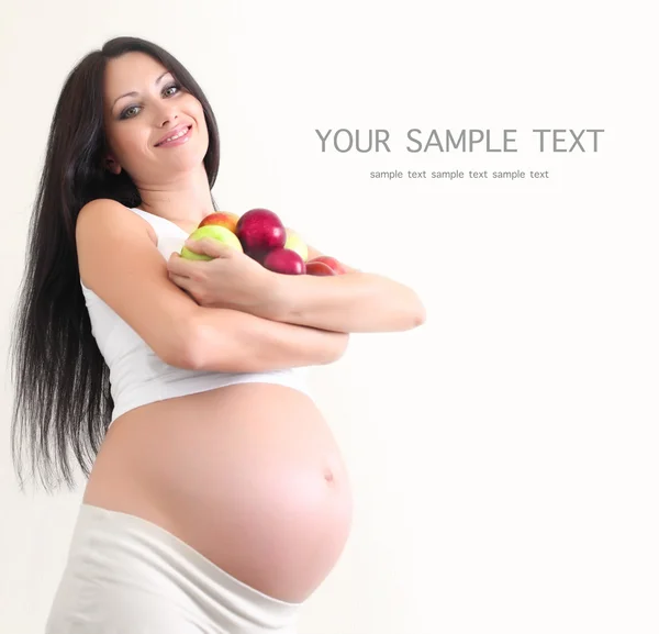 Femme enceinte avec des fruits — Photo