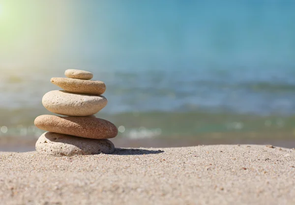 Stack of stones on sand — Stock Photo, Image