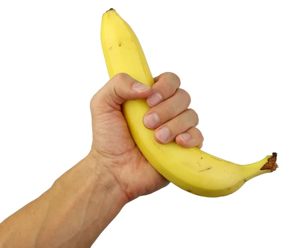 Mão humana segurando uma banana — Fotografia de Stock