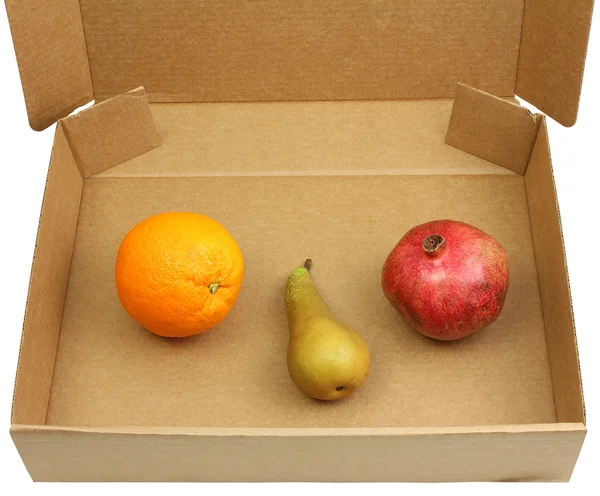 Gránátalma, a körte és a narancs doboz — Stock Fotó