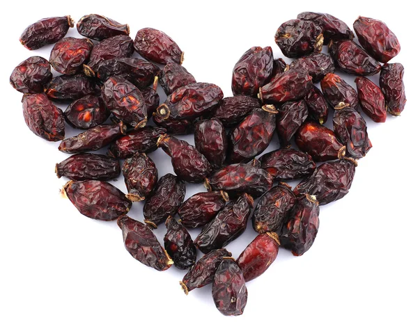 Dried rosehips in a heart shape — Stock Photo, Image