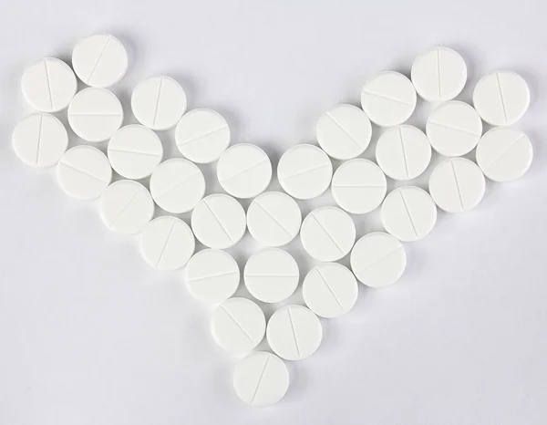 Many of round pills in form of heart — Stock Photo, Image