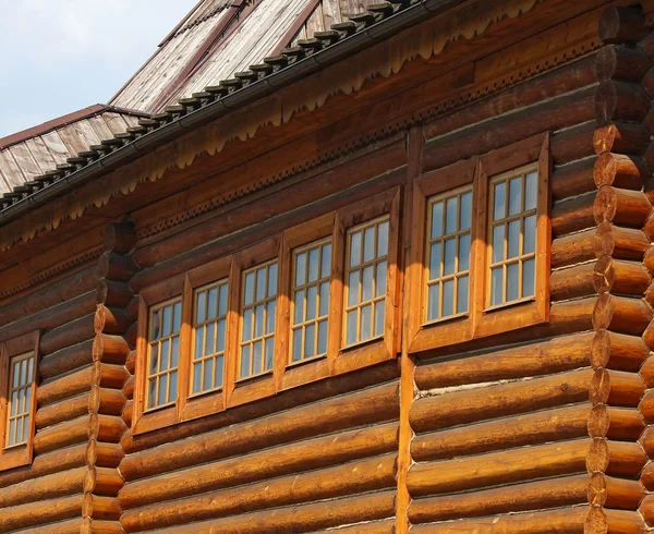 Windows in an old-style wooden house — Stock Photo, Image