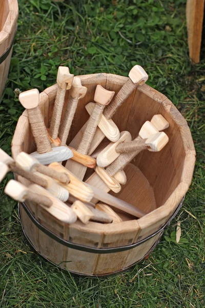 Wooden swords in wooden bucket — Stock Photo, Image