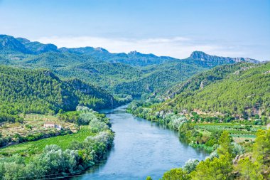 Ebro river valley near village Miravet in Catalonia, Spain, site of the Miravet castle of templar knights on  clipart