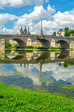 Blois, Loire Valley, France: Blois skyline, city on the shores of Loire River with Jacques Gabriel bridge, capital of Loir-et-Cher department in central France, dramatic cloudscape on sunny summer day