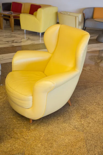 Modern vintage style yellow cream leather chair — Stock Photo, Image