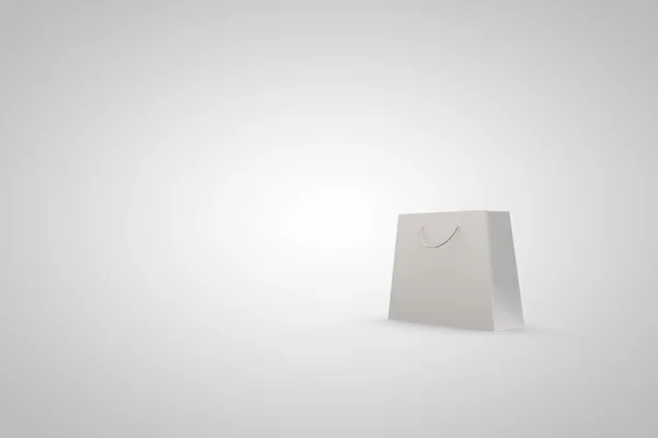 Белый бумажный пакет на белом фоне с пустым участком — стоковое фото