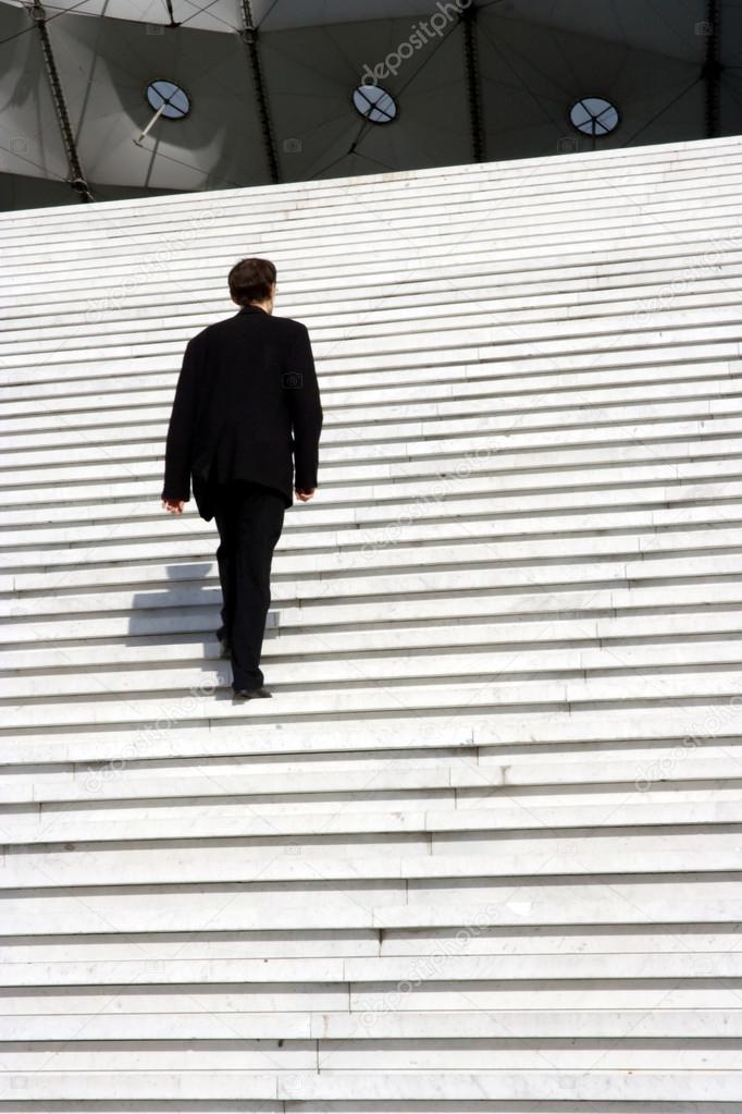 Businessman climbing stairs