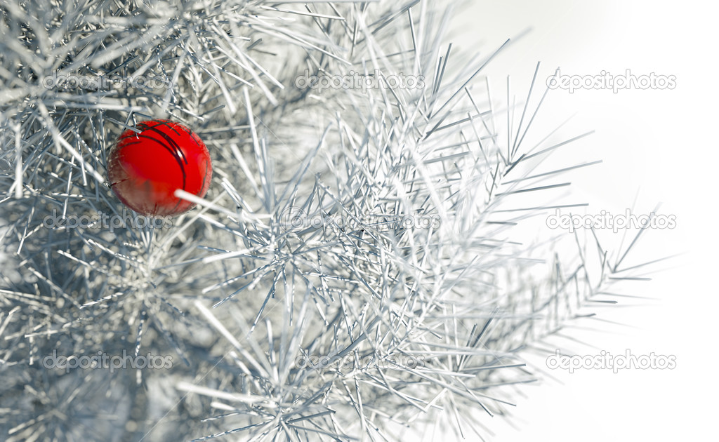 Christmas red ball on snowy conifer