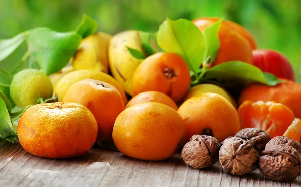 Citrus fruits and walnuts — Stock Photo, Image