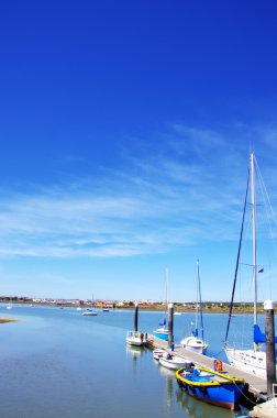 Fishing boats at Seixal bay, Portugal clipart