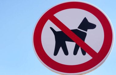 prohibited  entry of dogs, roadsign against blue sky