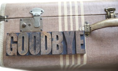 Goodbye word on vintage suitcase clipart