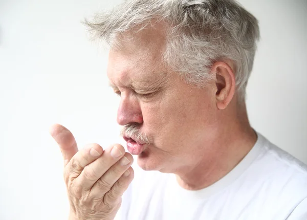 Man sneezes — Stock Photo, Image